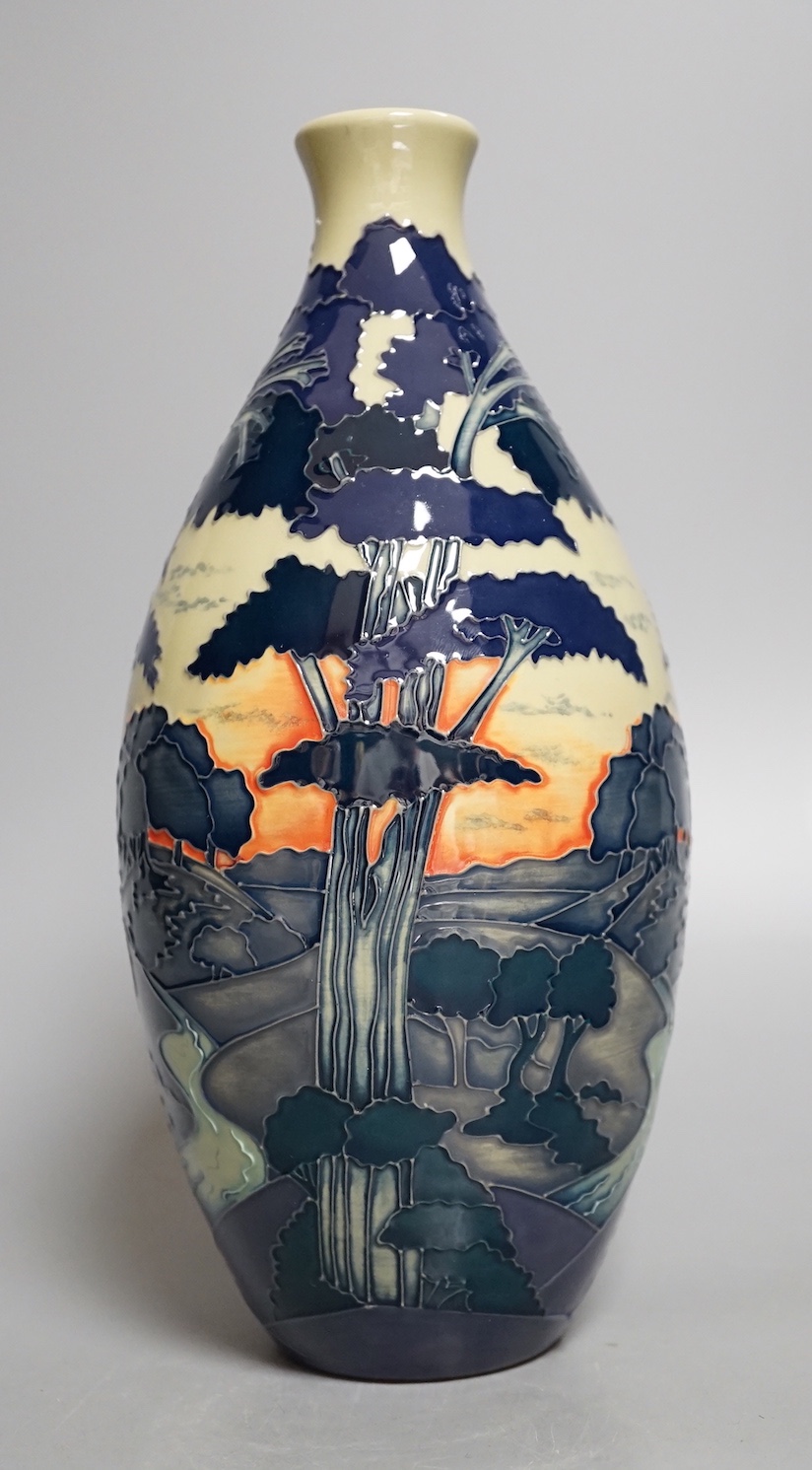 A Moorcroft 'trees in a dusky landscape' trial vase, boxed, 23.5 cms high.